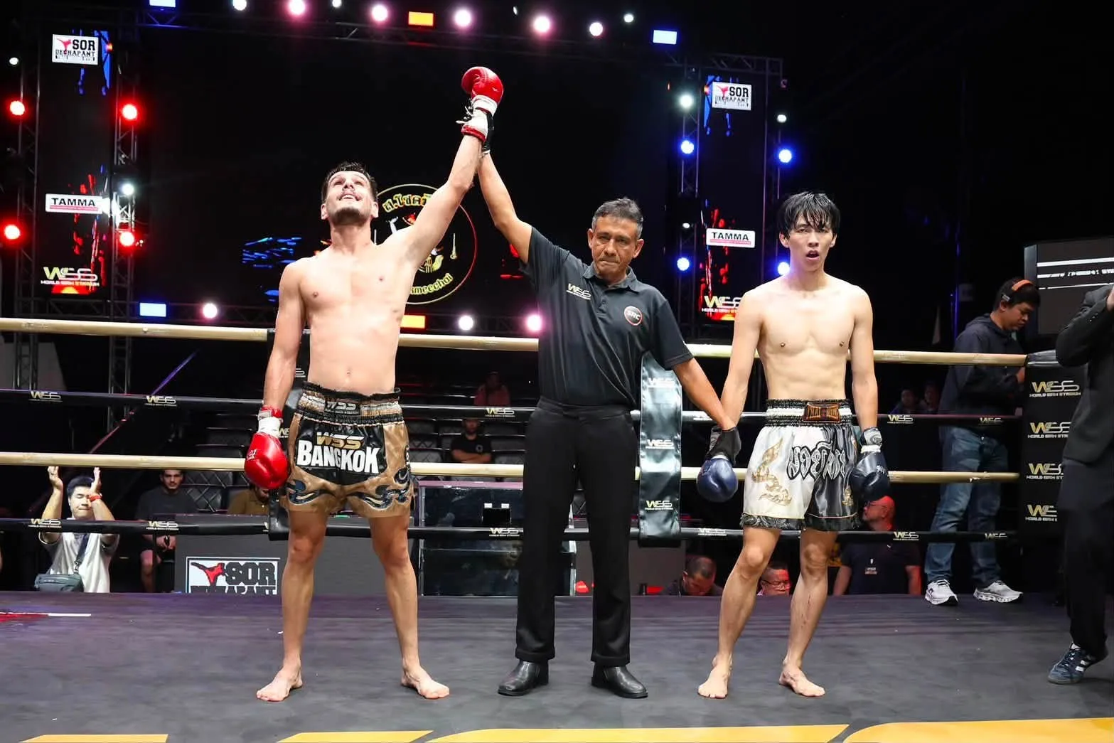 A referee raises the winning fighter's glove after an SRC bout
